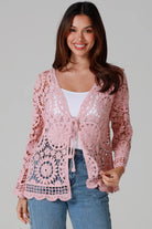 Women in blush pink cotton crochet cardigan with tie front and scalloped hem - boho chic cardigan Australia.