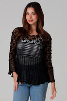 woman wearing black cotton crochet top with scalloped sleeves and flared hem - Boho crochet blouse Australia.