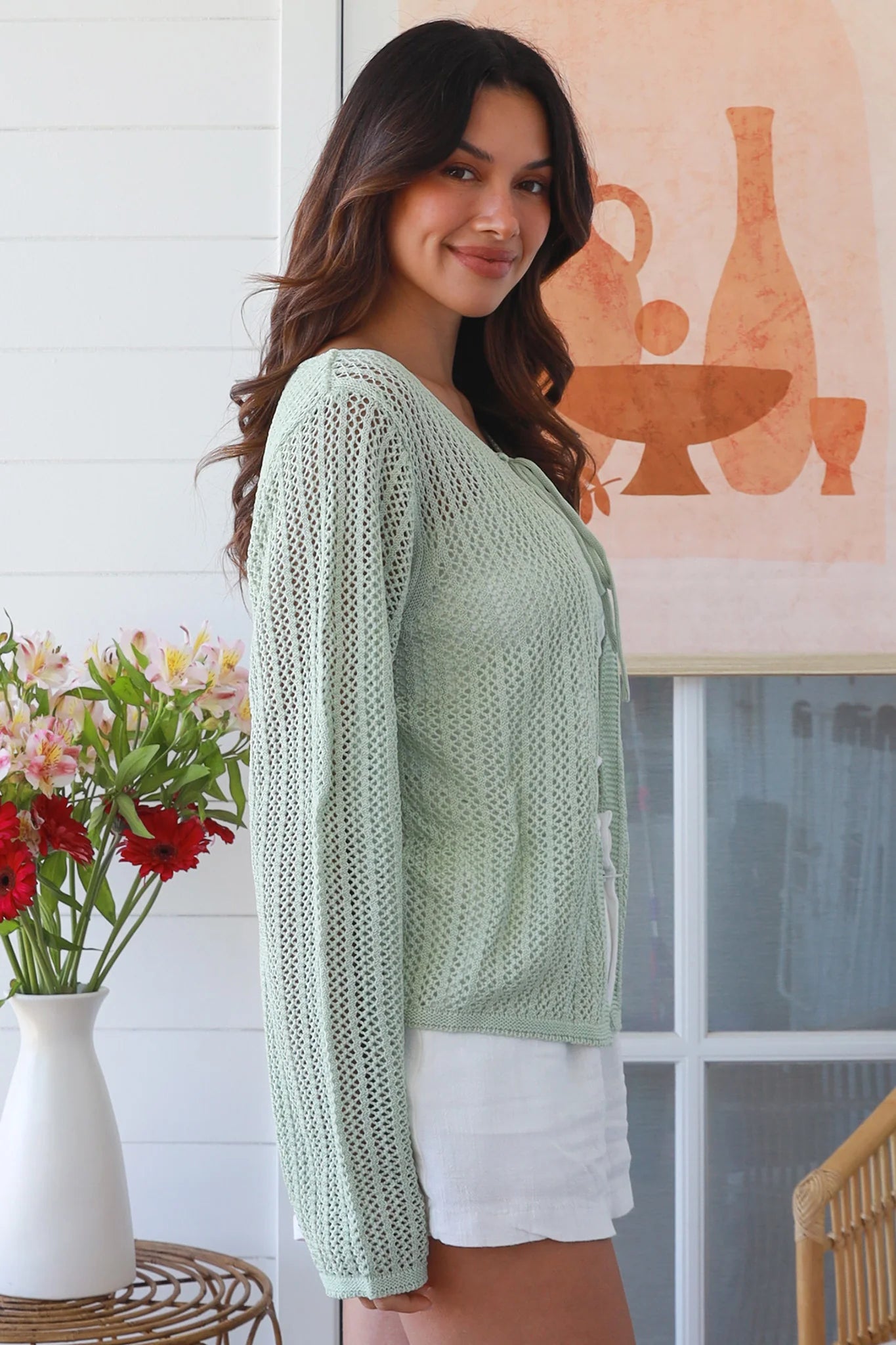 Woman wearing sage cotton crochet cardigan – textured boho statement layer by Bohemian Love Runway
