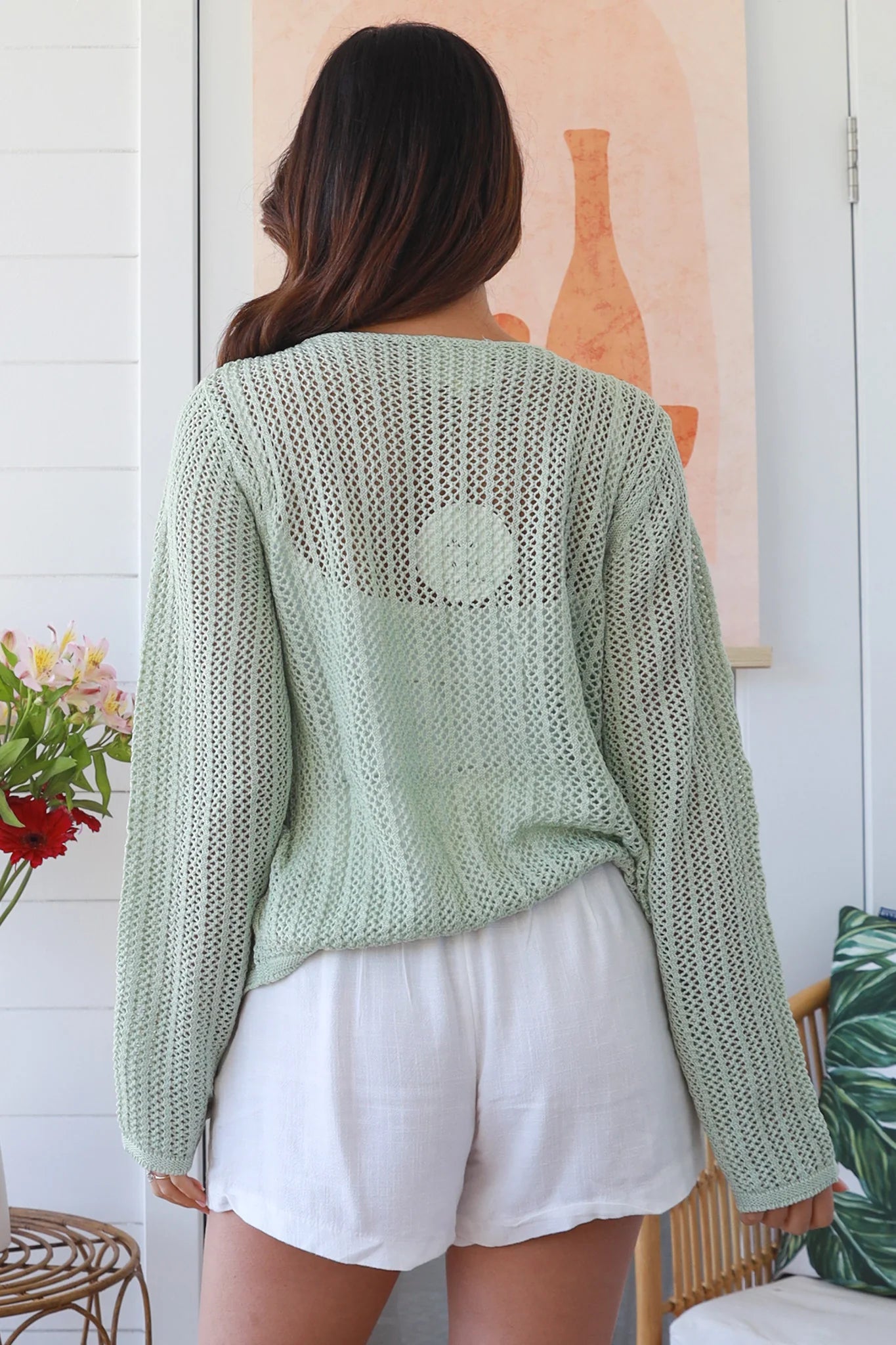 Woman wearing sage cotton crochet cardigan – textured boho statement layer by Bohemian Love Runway