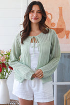 Woman wearing sage cotton crochet cardigan – textured boho statement layer by Bohemian Love Runway