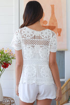 White cotton crochet top with mandala motifs scalloped sleeves and peplum hem – boho summer fashion