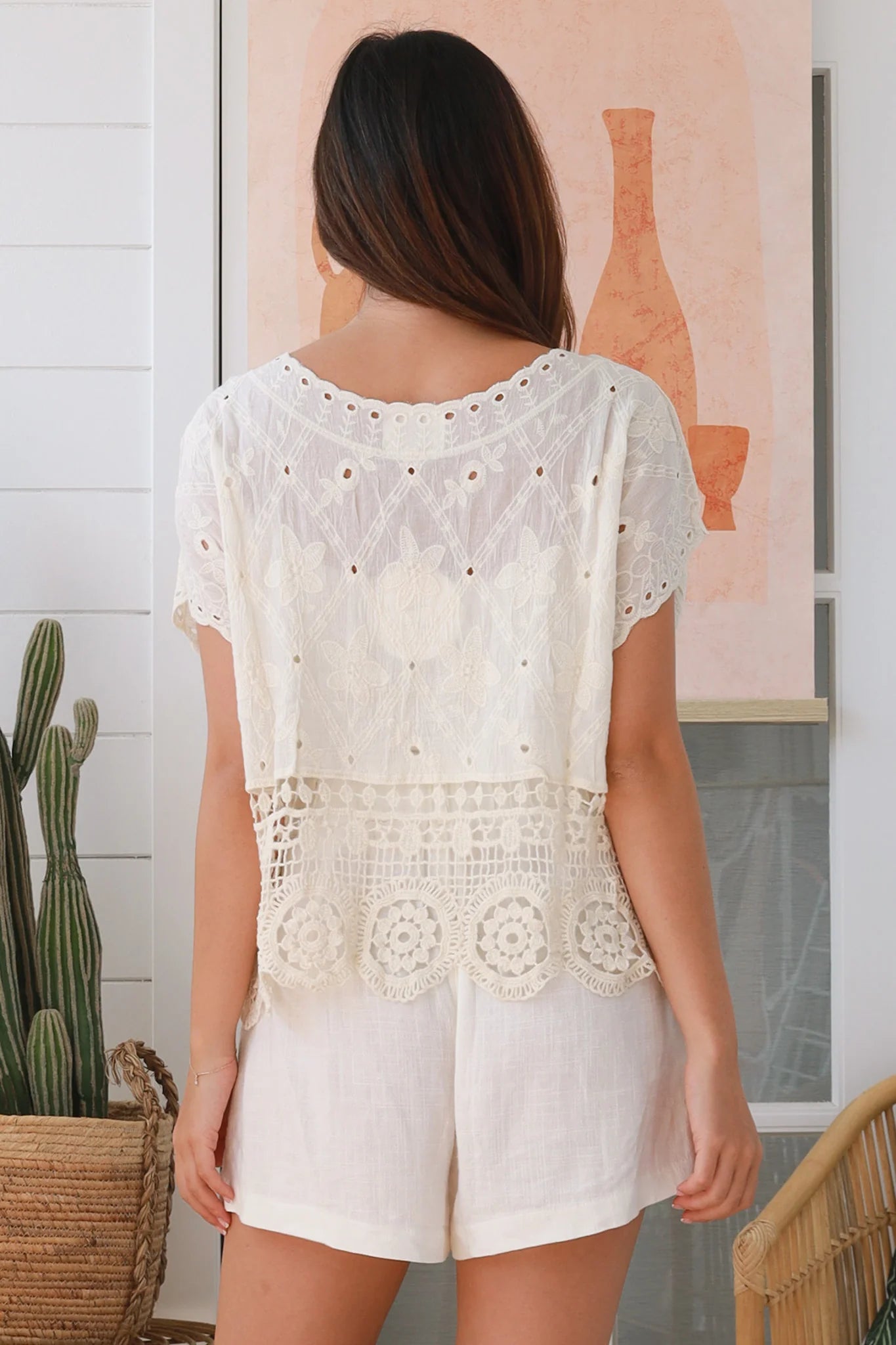 Cream embroidered cotton crochet top with round neck, short sleeves, and lace hem – boho clothing Australia.