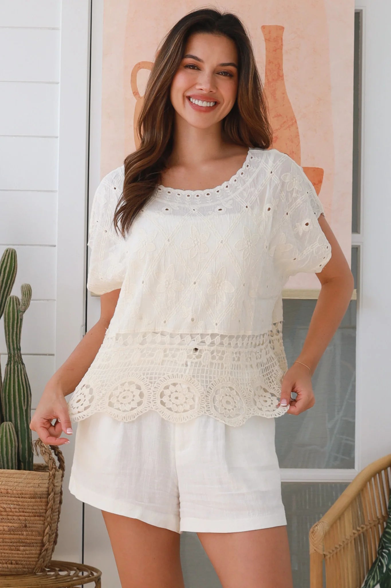 Cream embroidered cotton crochet top with round neck, short sleeves, and lace hem – boho clothing Australia.