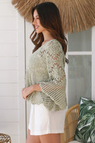 Model wearing sage green cotton crochet top with honeycomb lace and flared sleeves - Willow crochet Top Australia