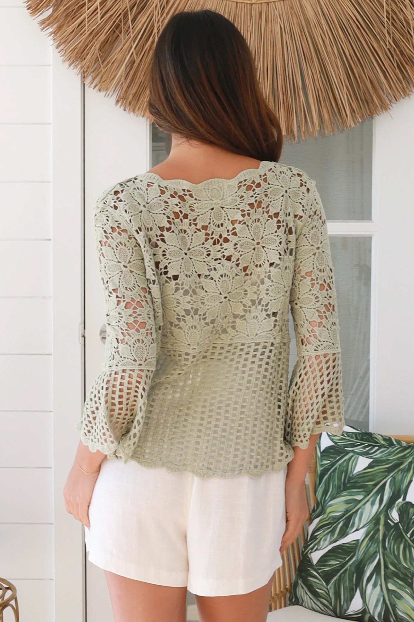 Model wearing sage green cotton crochet top with honeycomb lace and flared sleeves - Willow crochet Top Australia