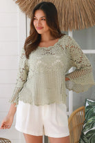 Model wearing sage green cotton crochet top with honeycomb lace and flared sleeves - Willow crochet Top Australia