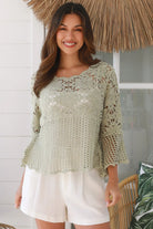 Model wearing sage green cotton crochet top with honeycomb lace and flared sleeves - Willow crochet Top Australia