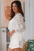 White cotton crochet boho top with bell sleeves, tassel ties and floral lace pattern - The Poet Crochet Bell Sleeve Top