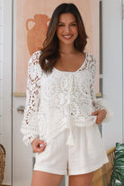 White cotton crochet boho top with bell sleeves, tassel ties and floral lace pattern - The Poet Crochet Bell Sleeve Top