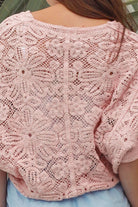 Pink embroidered cotton lace cardigan with V-neckline, button-through front and softly rounded hem