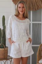 white embroidered cotton and crochet boho top with scalloped sleeves breathable cotton blouse australia