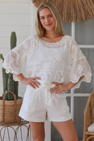 white embroidered cotton and crochet boho top with scalloped sleeves breathable cotton blouse australia