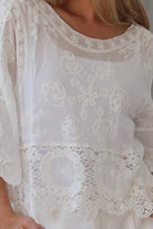 white embroidered cotton and crochet boho top with scalloped sleeves breathable cotton blouse australia