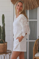 white embroidered cotton and crochet boho top with scalloped sleeves breathable cotton blouse australia