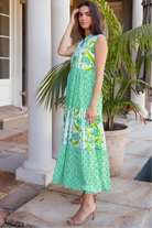 Maruka Green vintage-style tiered cotton maxi dress with sleeveless bodice, V-neckline, mandarin collar and pockets – boho summer style.