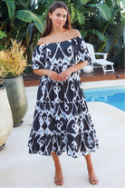 Black ikat boho midi dress worn on or off shoulder with empire waist cotton lace trim tiers and shirred back panel