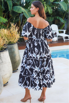 Black ikat boho midi dress worn on or off shoulder with empire waist cotton lace trim tiers and shirred back panel
