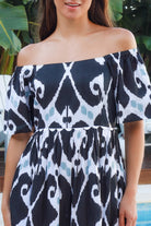 Black ikat boho midi dress worn on or off shoulder with empire waist cotton lace trim tiers and shirred back panel