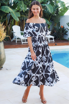 Black ikat boho midi dress worn on or off shoulder with empire waist cotton lace trim tiers and shirred back panel