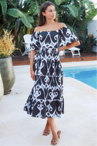 Black ikat boho midi dress worn on or off shoulder with empire waist cotton lace trim tiers and shirred back panel