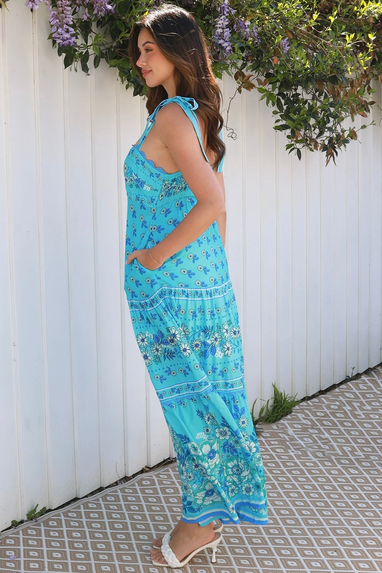 Woman wearing vintage floral boho tie-shoulder maxi dress with border print, rickrack lace and tiered hem – Dreamcatcher Isle of Bloom