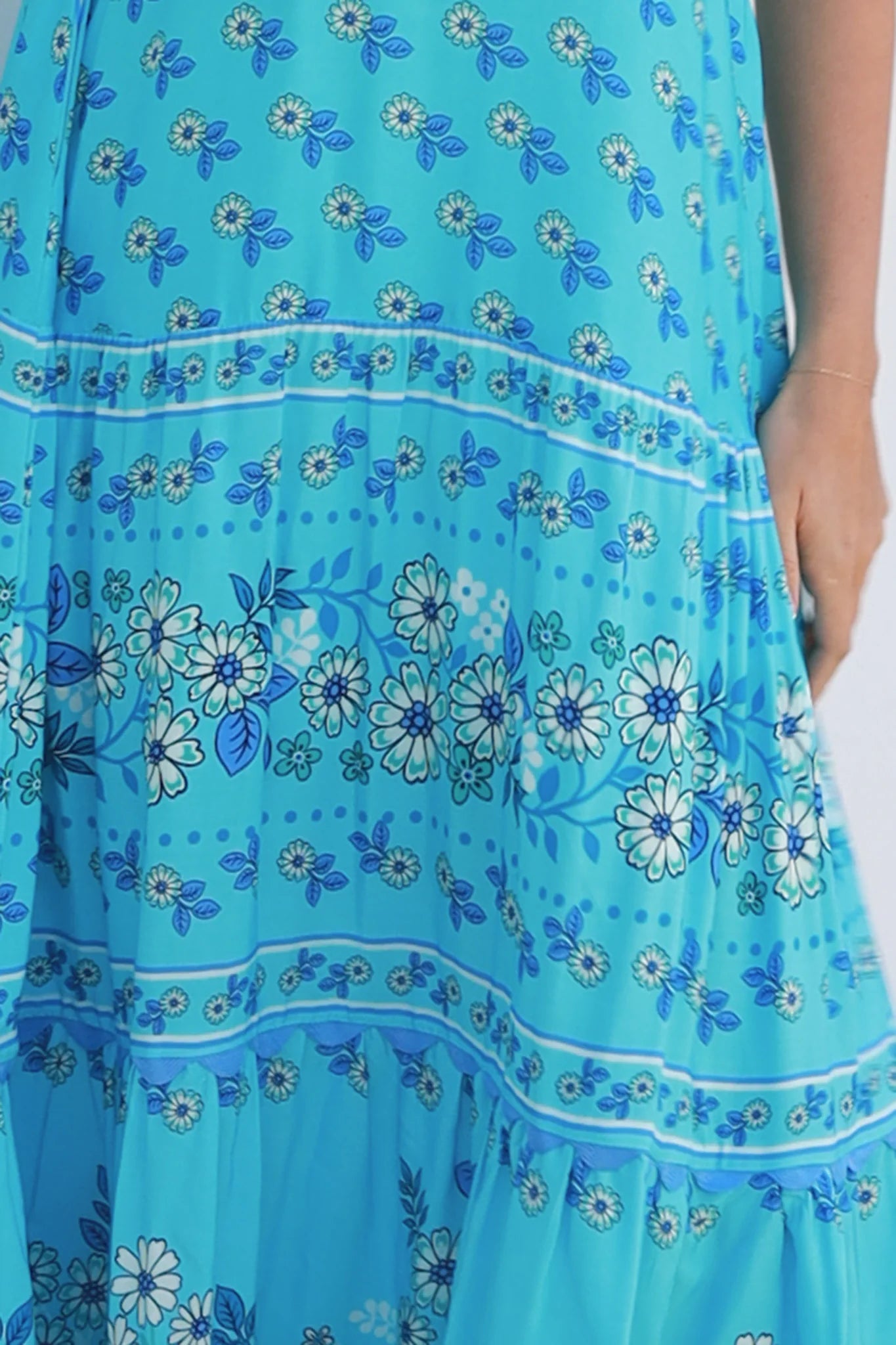 Woman wearing vintage floral boho tie-shoulder maxi dress with border print, rickrack lace and tiered hem – Dreamcatcher Isle of Bloom