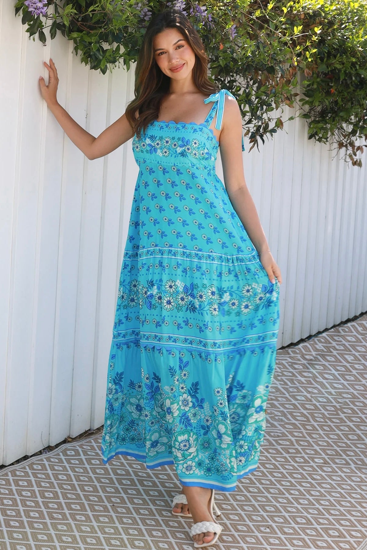 Woman wearing vintage floral boho tie-shoulder maxi dress with border print, rickrack lace and tiered hem – Dreamcatcher Isle of Bloom