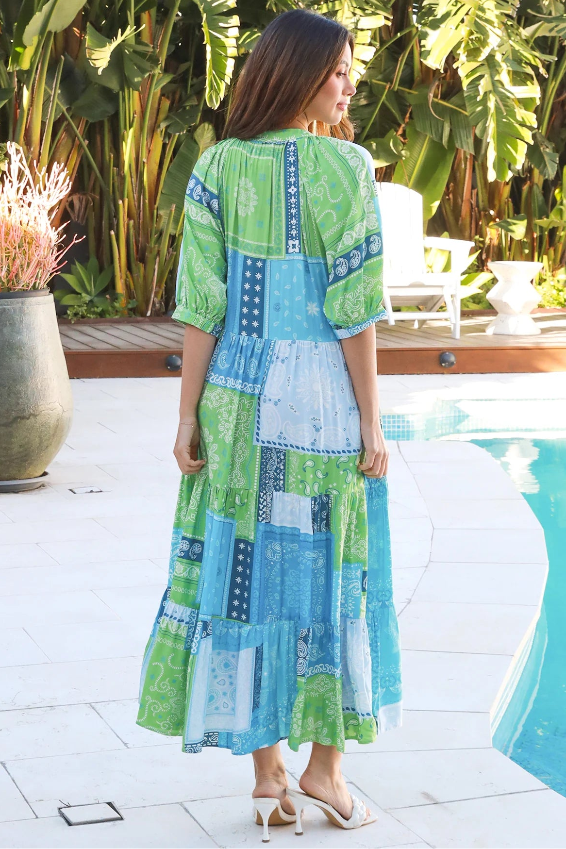 Woman in blue-green patchwork boho midi dress with v-neck and cuffed sleeves – Dreamcatcher Australia
