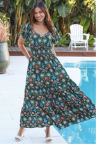 Emily bohemian maxi dress in green rayon with flutter sleeves tiered skirt and shirred back
