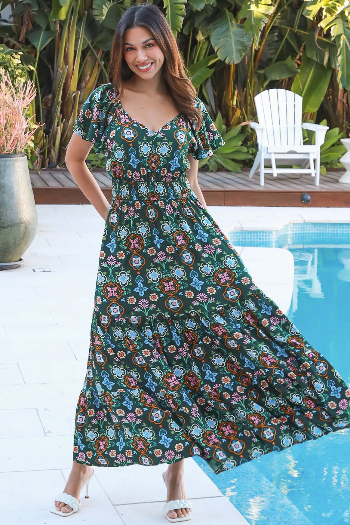 Emily bohemian maxi dress in green rayon with flutter sleeves tiered skirt and shirred back
