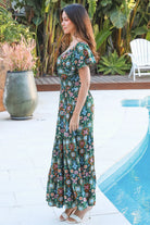 Emily bohemian maxi dress in green rayon with flutter sleeves tiered skirt and shirred back
