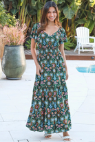 Emily bohemian maxi dress in green rayon with flutter sleeves tiered skirt and shirred back