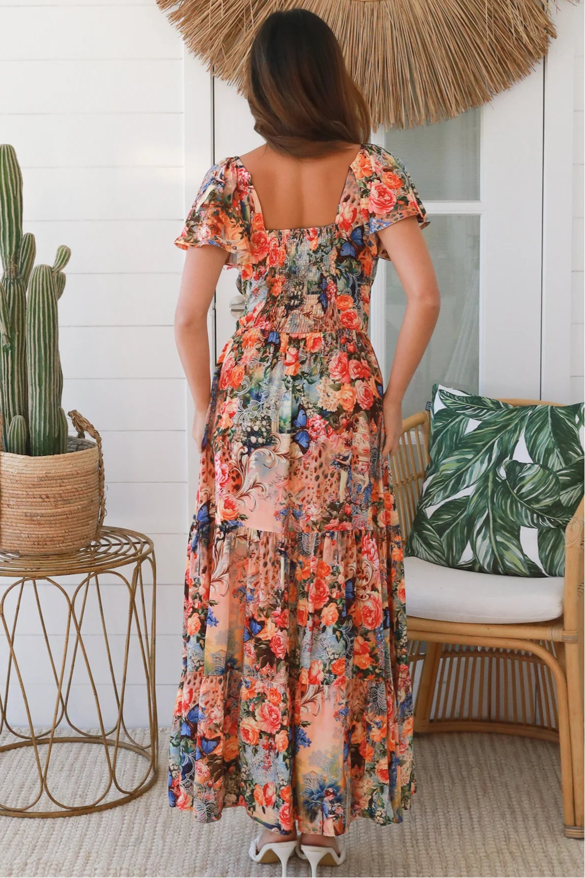 Bohemian maxi dress in butterfly floral print with elastic waist, smocked back, pockets and dramatic tiered hemline