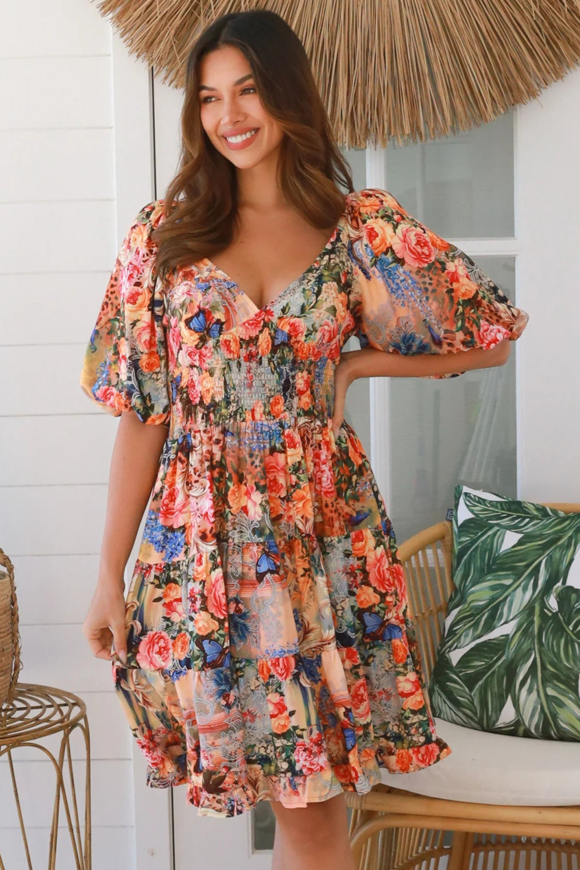 Boho mini dress in 100% rayon with floral butterfly print, shirred bodice and voluminous sleeves - designer bohemian style Australia.