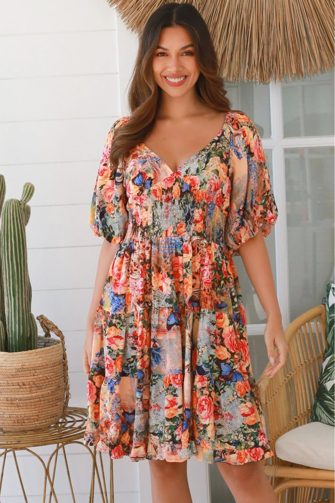 Boho mini dress in 100% rayon with floral butterfly print, shirred bodice and voluminous sleeves - designer bohemian style Australia.