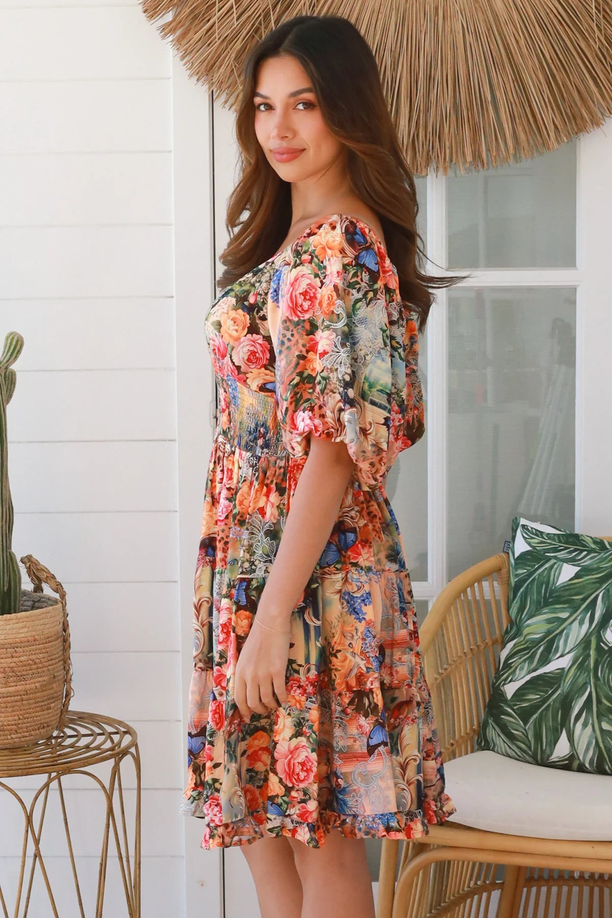 Boho mini dress in 100% rayon with floral butterfly print, shirred bodice and voluminous sleeves - designer bohemian style Australia.