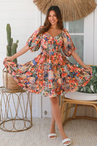 Boho mini dress in 100% rayon with floral butterfly print, shirred bodice and voluminous sleeves - designer bohemian style Australia.