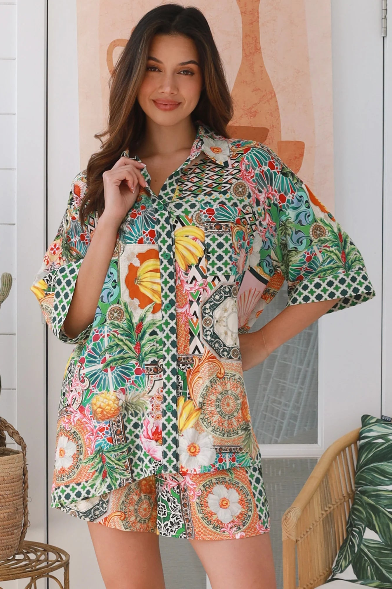 “Woman wearing tropical boho rayon shirt with border sleeves and pleated back – Amira Island Dream Shirt by Dreamcatcher, Bohemian Love Runway”