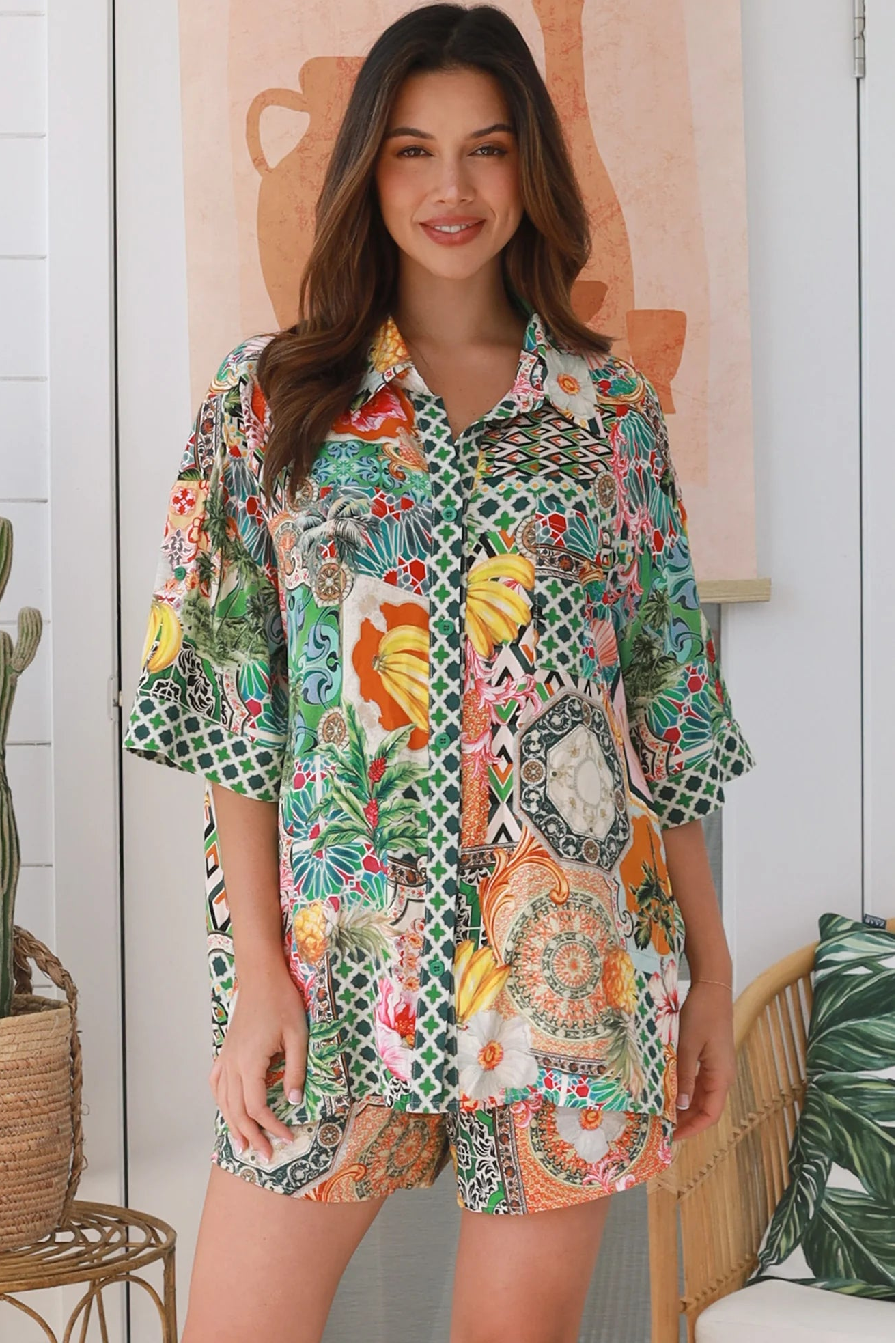 “Woman wearing tropical boho rayon shorts with border waistband and tie front – Amira Island Dream Shorts by Dreamcatcher, Bohemian Love Runway”