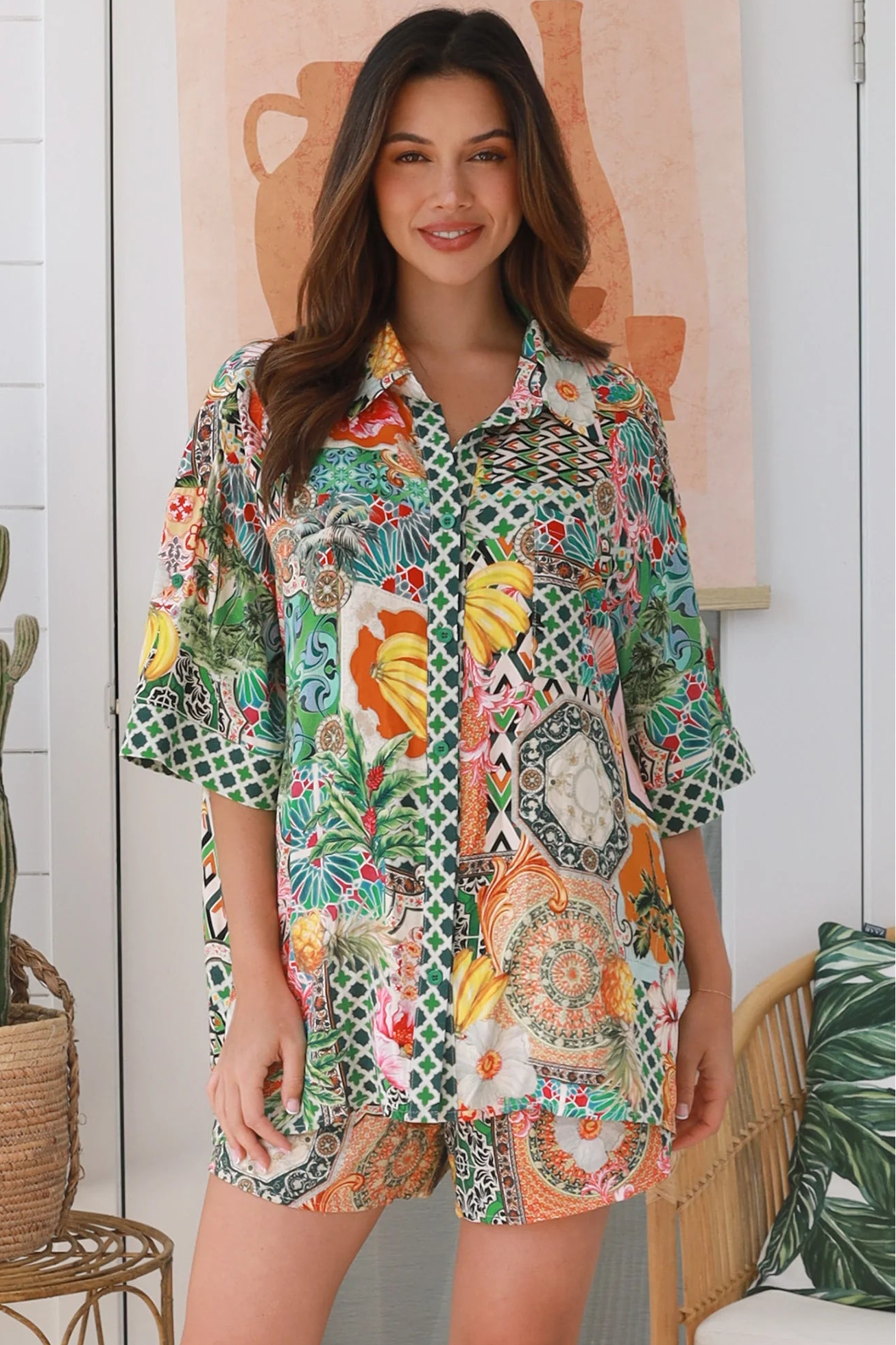 “Woman wearing tropical boho rayon shirt with border sleeves and pleated back – Amira Island Dream Shirt by Dreamcatcher, Bohemian Love Runway”