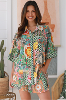“Woman wearing tropical boho rayon shorts with border waistband and tie front – Amira Island Dream Shorts by Dreamcatcher, Bohemian Love Runway”
