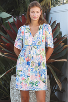 Boho mosaic mini dress with tassel ties and empire-line silhouette in colourful floral print for summer style Australia
