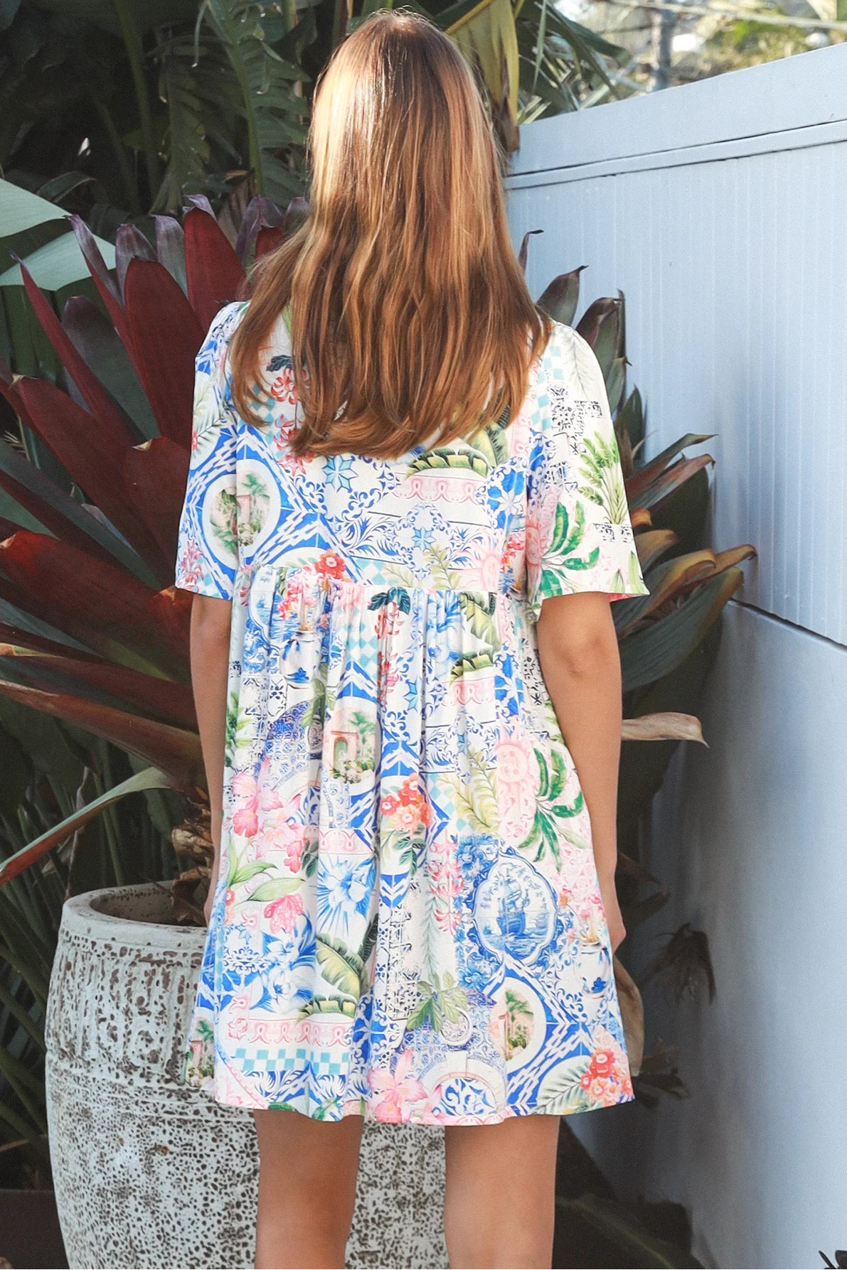Boho mosaic mini dress with tassel ties and empire-line silhouette in colourful floral print for summer style Australia
