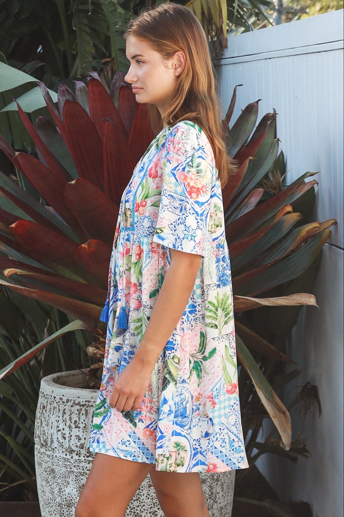 Boho mosaic mini dress with tassel ties and empire-line silhouette in colourful floral print for summer style Australia