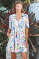 Boho mosaic mini dress with tassel ties and empire-line silhouette in colourful floral print for summer style Australia