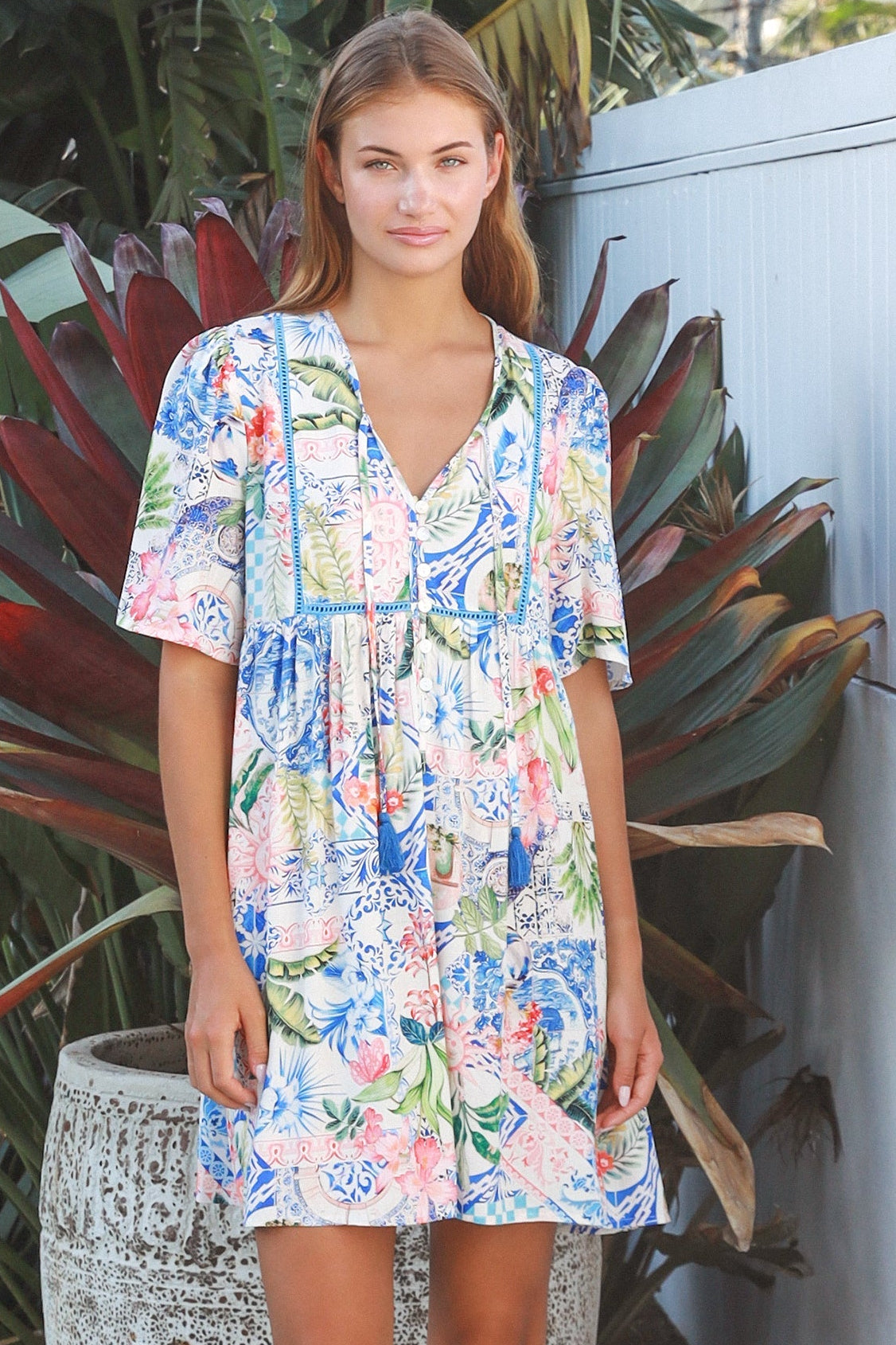 Boho mosaic mini dress with tassel ties and empire-line silhouette in colourful floral print for summer style Australia