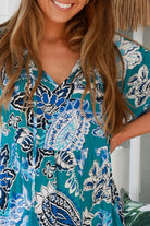 Oceane Paisley boho maxi dress in teal with tassel ties, ruched sleeves, oversized tiered skirt, side pockets, relaxed style, 100% rayon