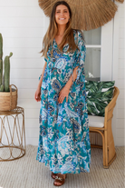 Oceane Paisley boho maxi dress in teal with tassel ties, ruched sleeves, oversized tiered skirt, side pockets, relaxed style, 100% rayon