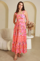Imogen tiered floral maxi dress in pink bohemian print with fitted bodice, tie back straps and oversized tiered skirt Australia